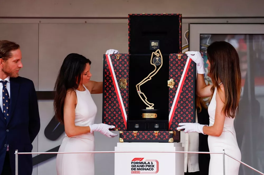The winners trophy is presented on the podium