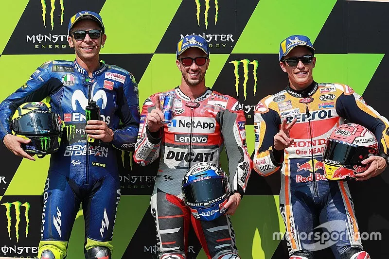 Pole sitter Andrea Dovizioso, Ducati Team, second place Valentino Rossi, Yamaha Factory Racing, third place Marc Marquez, Repsol Honda Team
