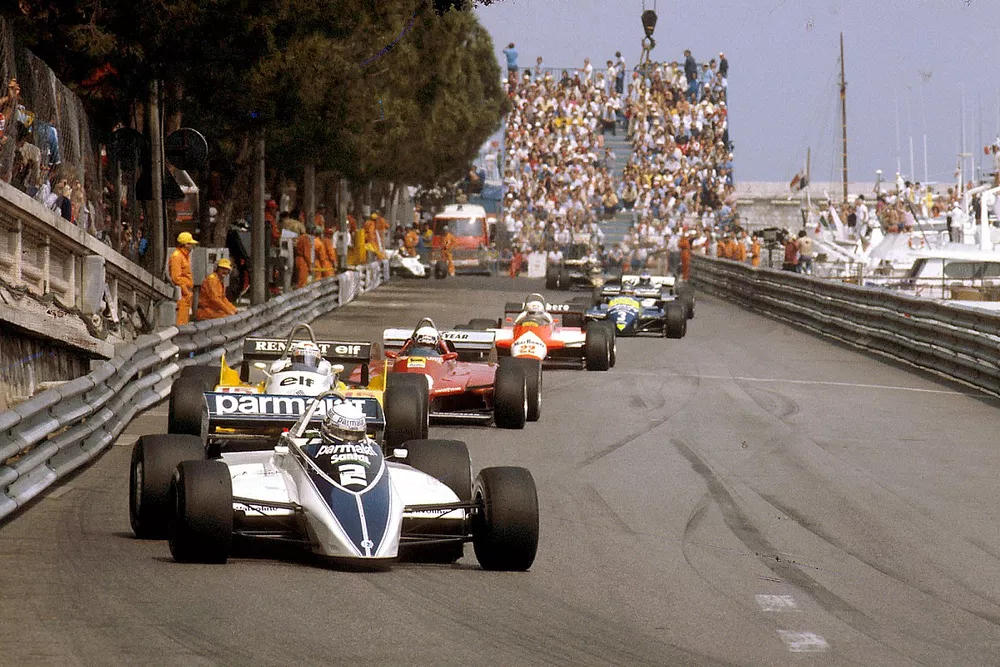 Riccardo Patrese, Brabham BT49D Ford leads Alain Prost, Renault RE30B, Didier Pironi, Ferrari 126C2 