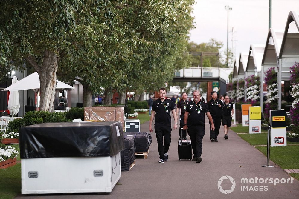 AlphaTauri Honda staff in the paddock amongst packing crates