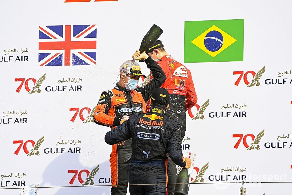 Jehan Daruvala, Carlin, Race Winner Felipe Drugovich, MP Motorsport and Callum Ilott, UNI-Virtuosi celebrate on the podium with the champagne