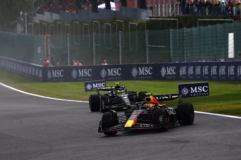 Sergio Perez, Red Bull Racing RB19, leads Lewis Hamilton, Mercedes F1 W14