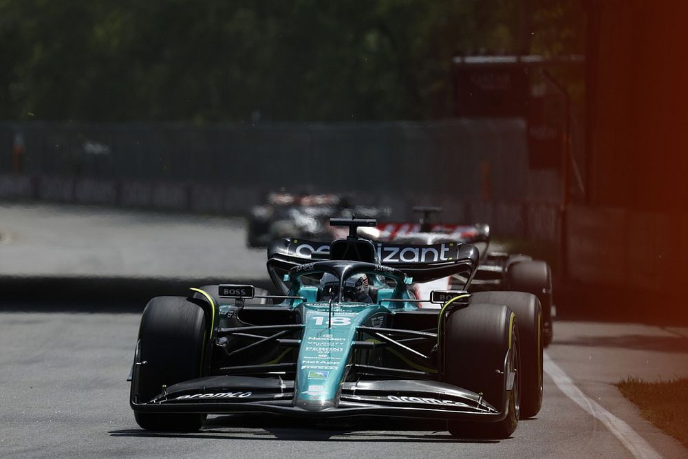 Lance Stroll, Aston Martin AMR23, Kevin Magnussen, Haas VF-23