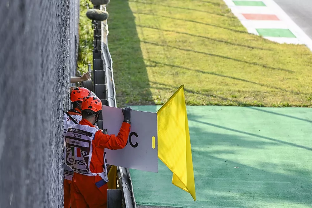Marshals wave the yellows and deploy the Safety Car board