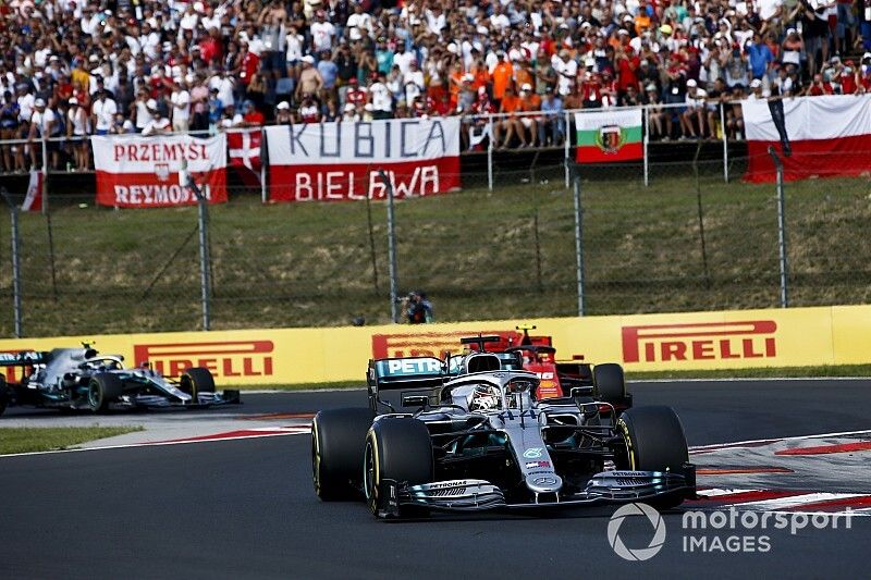 Lewis Hamilton, Mercedes AMG F1 W10 leads Charles Leclerc, Ferrari SF90 and Valtteri Bottas, Mercedes AMG W10