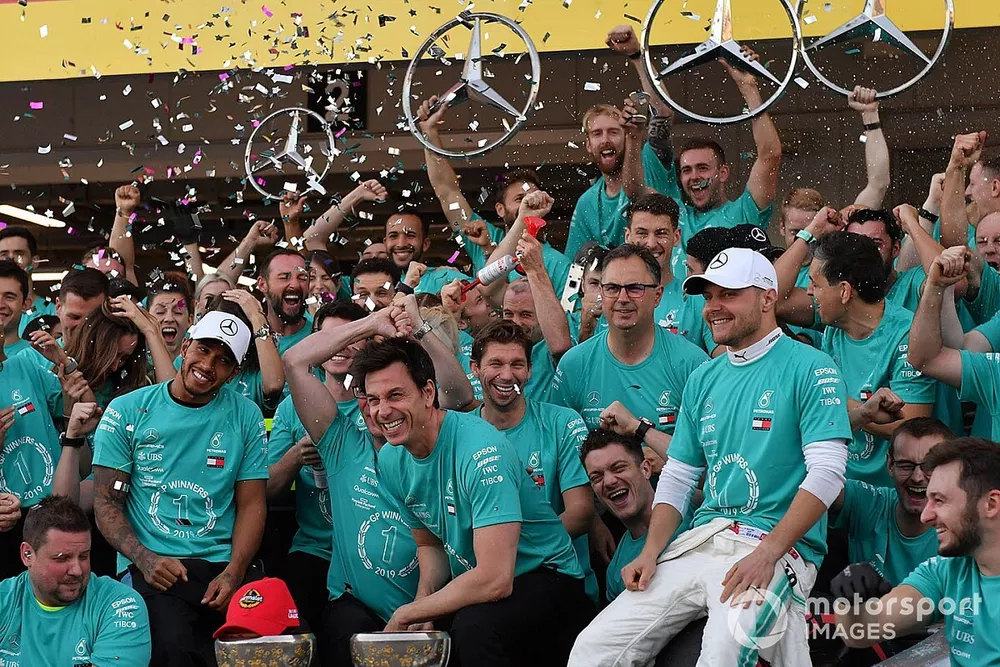 The Mercedes team celebrates after clinching their record 6th consecutive Constructors title