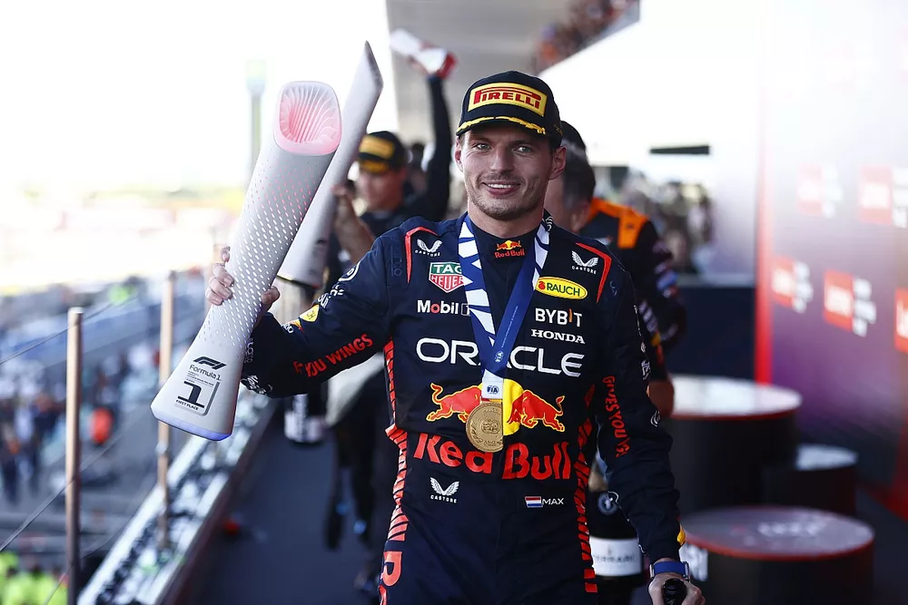 Max Verstappen, Red Bull Racing, 1st position, leaves the podium with his trophy 