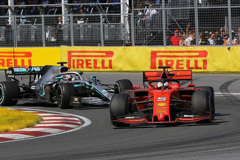 Sebastian Vettel, Ferrari SF90, leads Lewis Hamilton, Mercedes AMG F1 W10