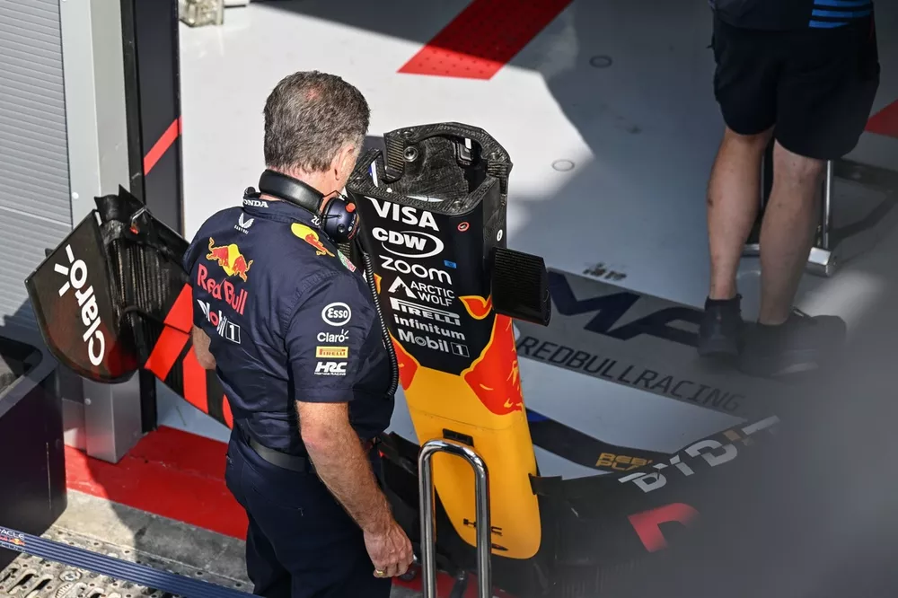 Christian Horner, Team Principal, Red Bull Racing, inspects a nose section