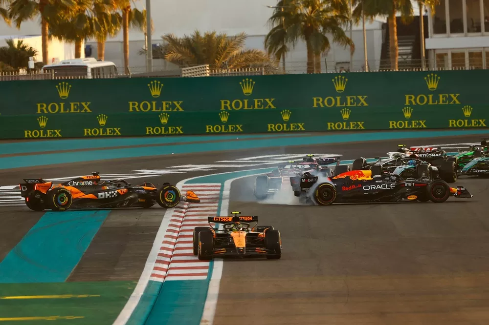 Oscar Piastri, McLaren MCL38 and Max Verstappen, Red Bull Racing RB20 collide on the corner causing each other to spin