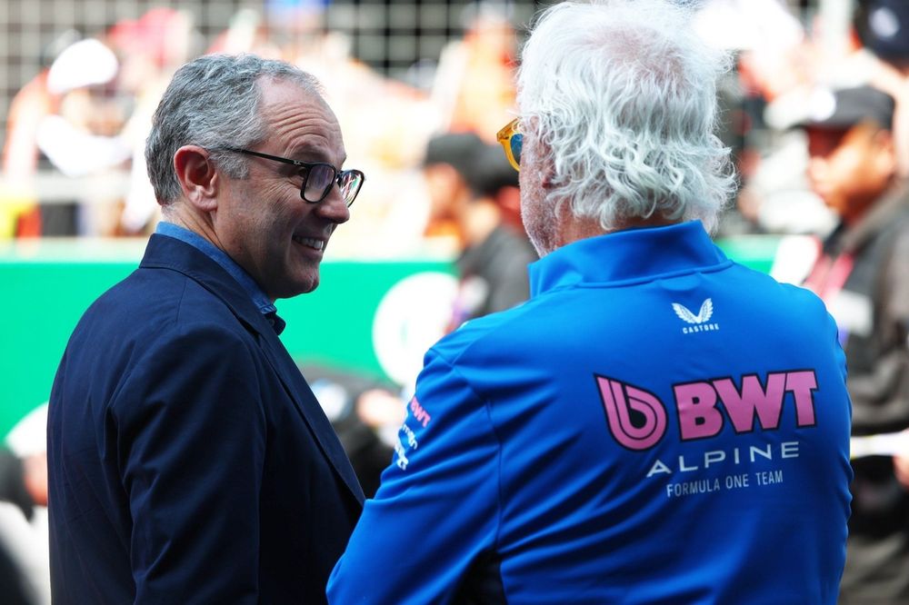 Stefano Domenicali, CEO of the Formula One Group talks with Flavio Briatore, Executive Advisor of Alpine F1 ahead of the tribute to the late Eddie Jordan