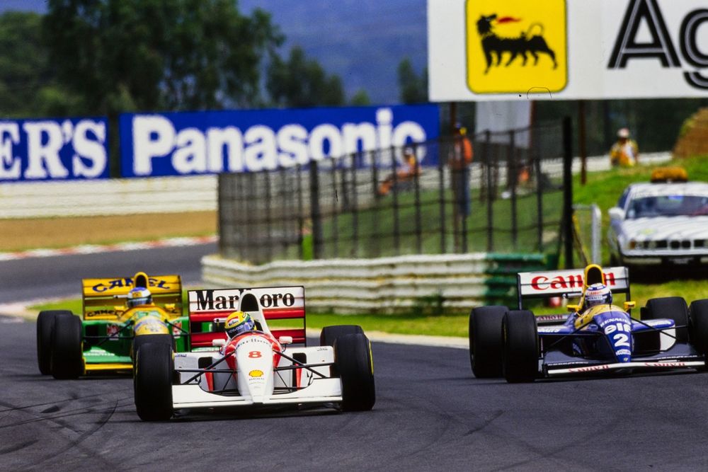 Ayrton Senna, McLaren MP4-8, leads Alain Prost, Williams FW15C, and Michael Schumacher, Benetton B193A