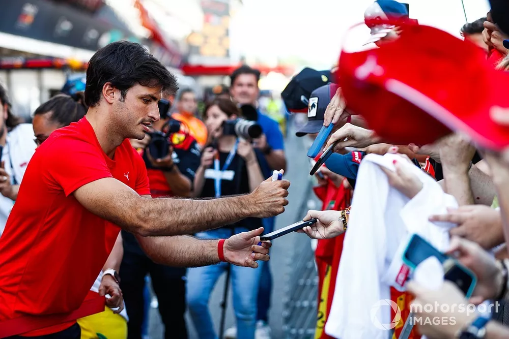 Carlos Sainz, Ferrari, signs autographs for fans