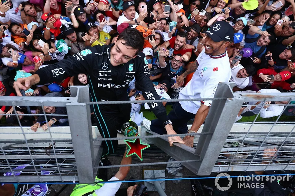 George Russell, Mercedes AMG, 1st position, Lewis Hamilton, Mercedes AMG, 2nd position, celebrate with fans after the race
