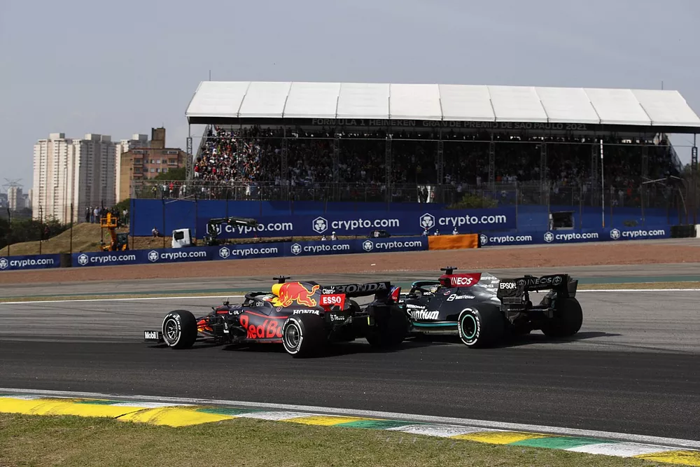Max Verstappen, Red Bull Racing RB16B, battles with Lewis Hamilton, Mercedes W12