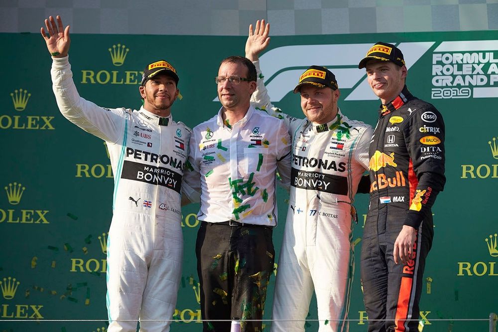 Lewis Hamilton, Mercedes AMG F1, 2nd position, the Mercedes Constructors delegate, Valtteri Bottas, Mercedes AMG F1, 1st position, and Max Verstappen, Red Bull Racing, 3rd position, on the podium