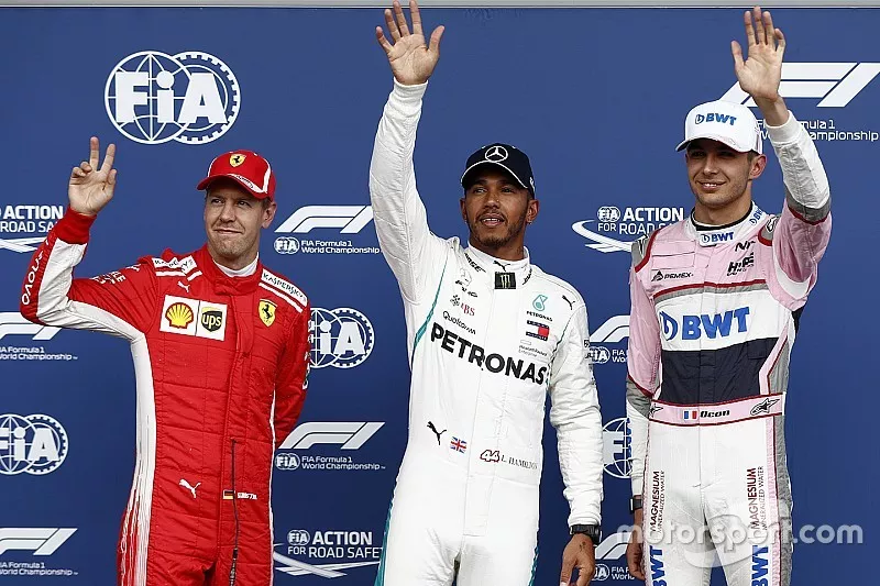 Pole sitter Lewis Hamilton, Mercedes AMG F1, second place Sebastian Vettel, Ferrari, third place Esteban Ocon, Racing Point Force India VJM11
