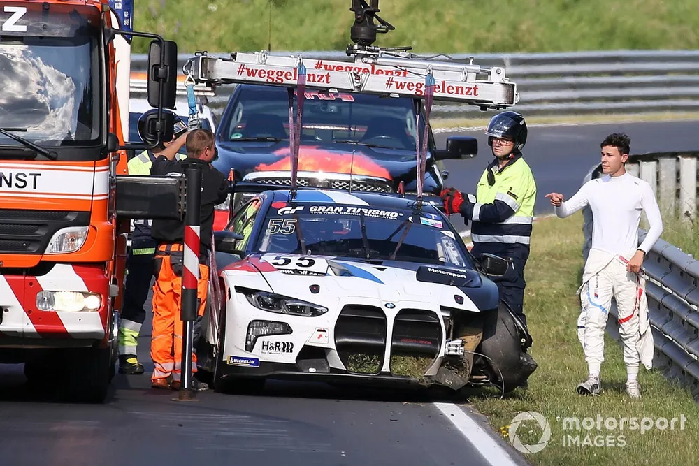 Sheldon van der Linde looks at damage after an accident with the BMW M4 GT3