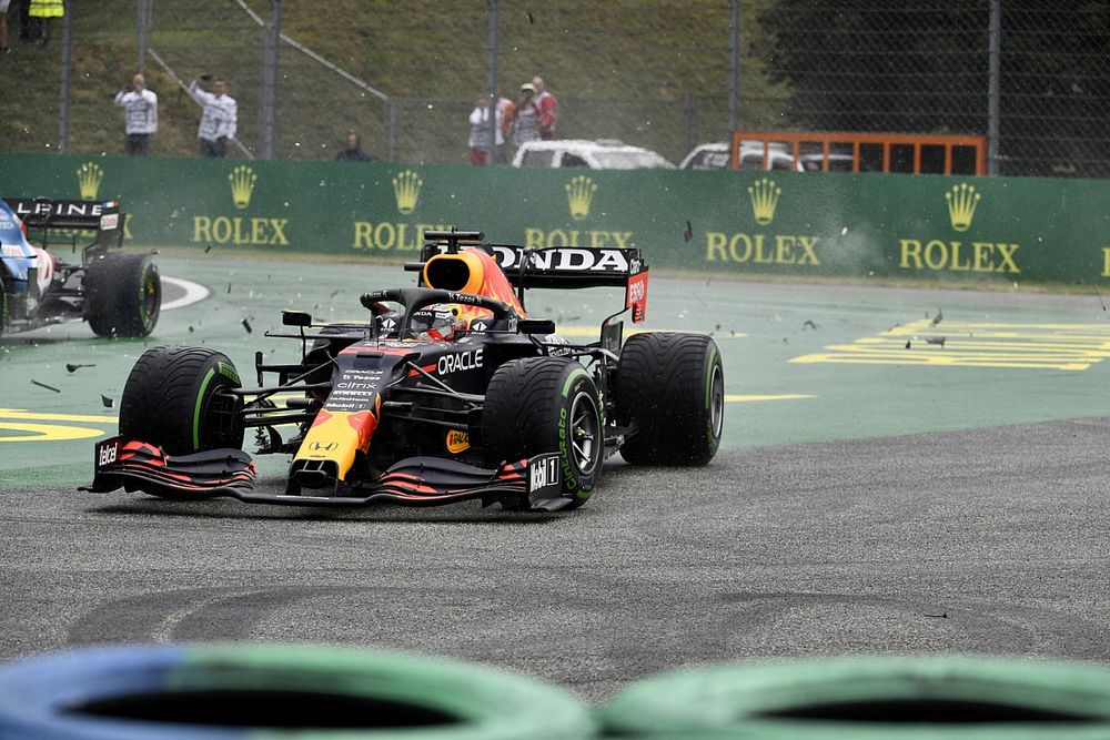 Max Verstappen, Red Bull Racing RB16B, is caught up in a collision at the start