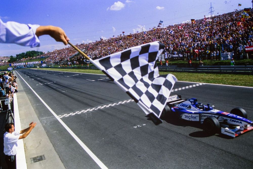 Damon Hill, Arrows A18 Yamaha, crosses the finish line in second place