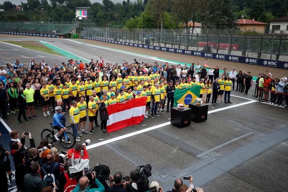 Drivers of the Formula 1, Formula 2, Formula 3 paddocks stand on the grid in memory of Ayrton Senna and Roland Ratzenberger