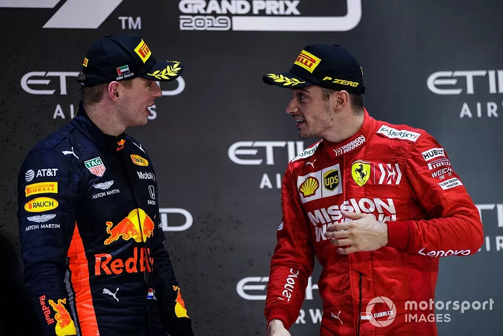 Max Verstappen, Red Bull Racing, 2nd position, and Charles Leclerc, Ferrari, 3rd position, talk on the podium