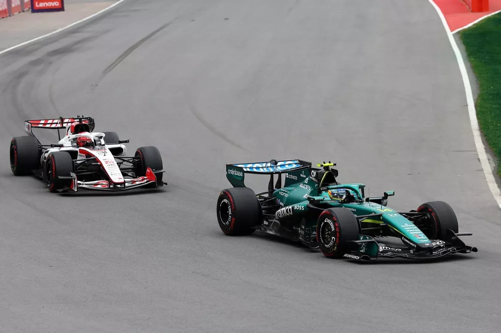 Fernando Alonso, Aston Martin Racing, Esteban Ocon, Haas F1 Team