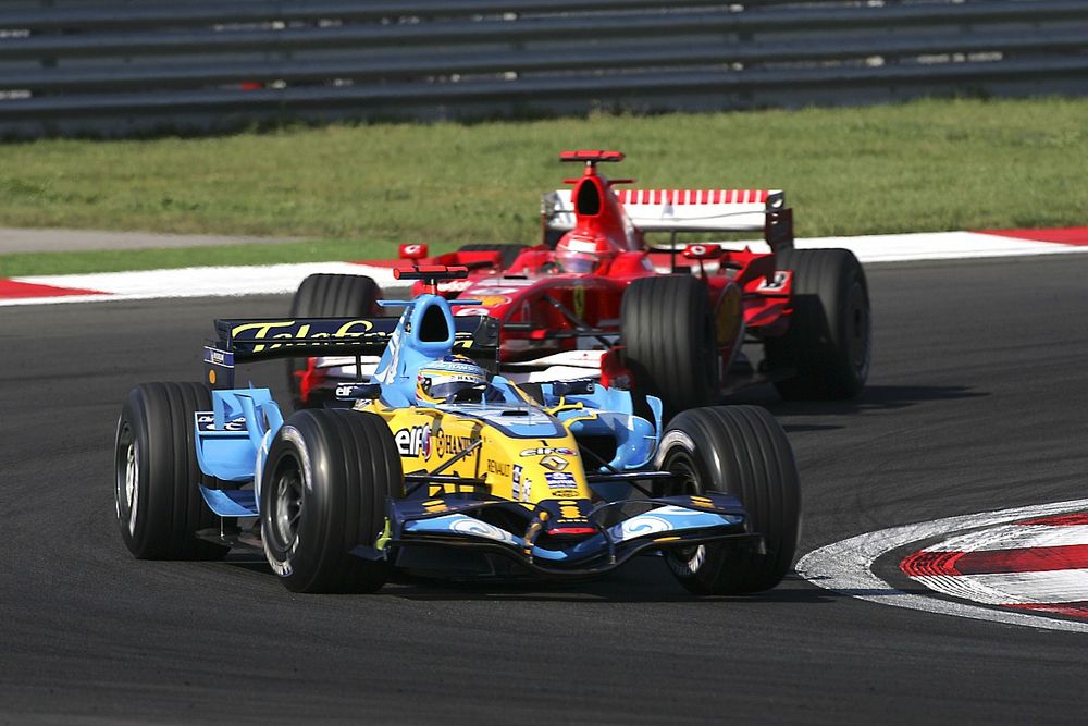 Fernando Alonso, Renault R26, leads Michael Schumacher, Ferrari 248 F1