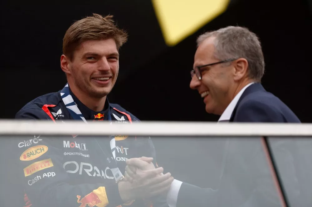 Max Verstappen, Red Bull Racing, 1st position, is congratulated on the podium by Stefano Domenicali, CEO, Formula 1