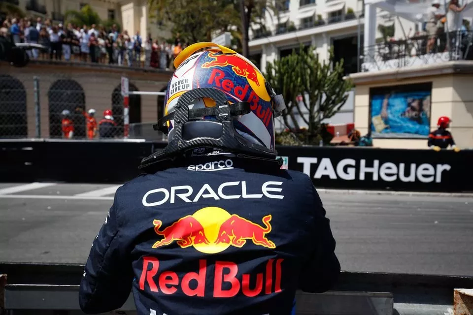 Sergio Perez, Red Bull Racing, by the side of the track after crashing out at the start