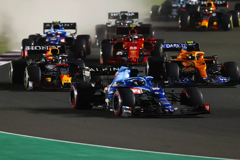 Fernando Alonso, Alpine A521, Max Verstappen, Red Bull Racing RB16B, Lando Norris, McLaren MCL35M, and Carlos Sainz Jr., Ferrari SF21