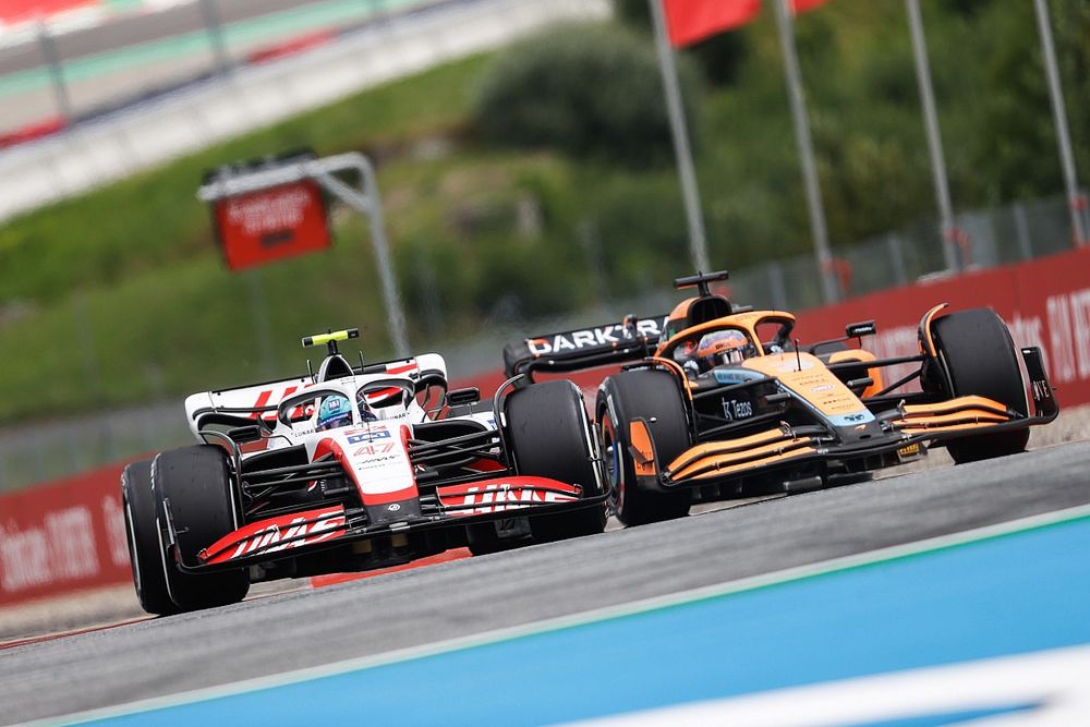 Daniel Ricciardo, McLaren MCL36, battles with Mick Schumacher, Haas VF-22