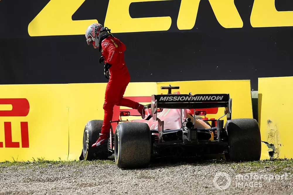 Charles Leclerc, Ferrari SF21, gets out of his car after going off