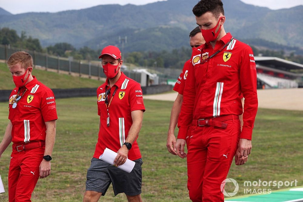 Sebastian Vettel, Ferrari, walks the track with colleagues