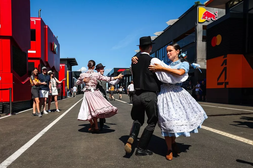 Local entertainers dance through the paddock 