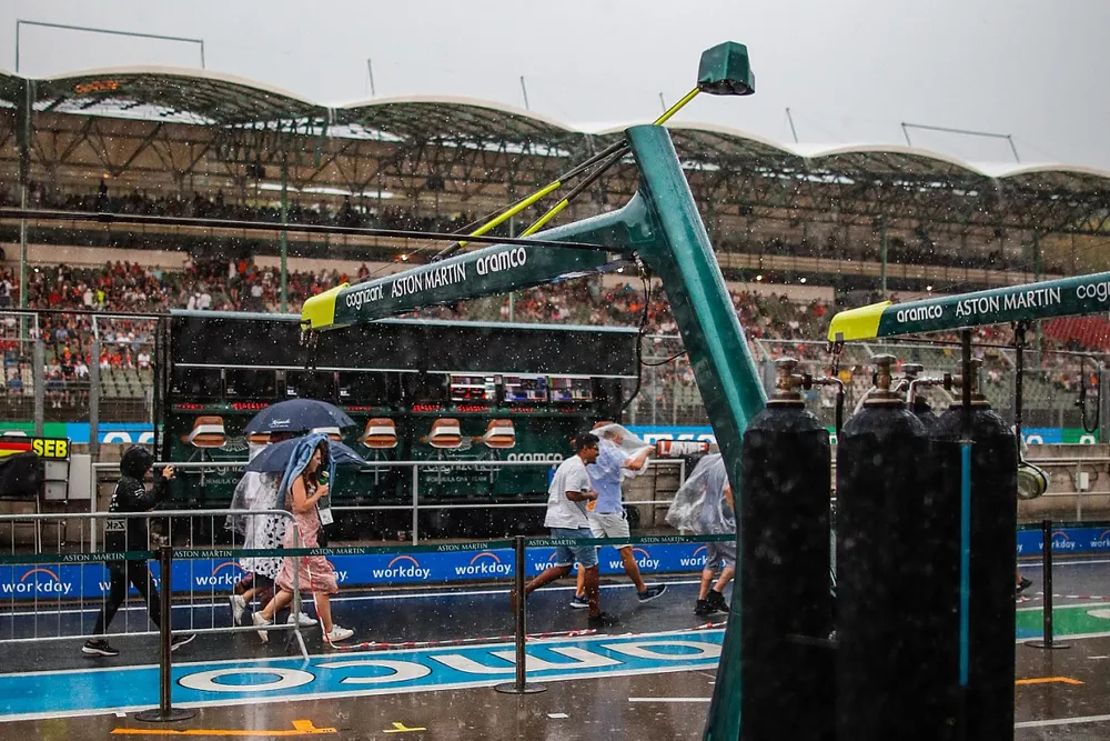 Rain falls outside of the Aston Martin pit ahead of FP3

