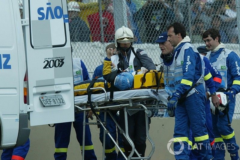 Fernando Alonso, Renault Renault F1 Team R23, gets put into an ambulance on a strecher