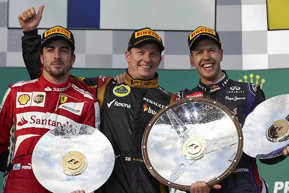 Podium : le vainqueur Kimi Raikkonen, Lotus, deuxi&egrave;me place Fernando Alonso, Ferrari, troisi&egrave;me place Sebastian Vettel, Red Bull Racing