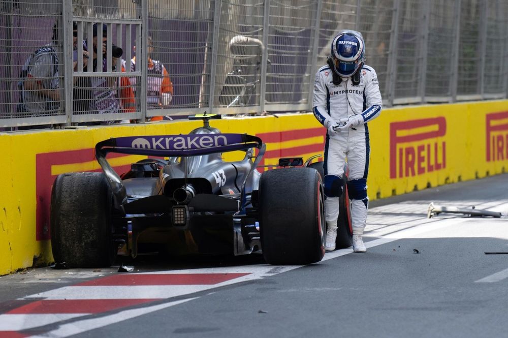Franco Colapinto, Williams Racing, climbs out of his damaged car after a crash in FP1