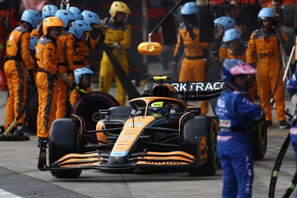 Lando Norris, McLaren MCL36, makes a pit stop
