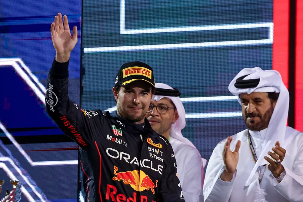 Sergio Perez, Red Bull Racing, 3rd position, arrives on the podium