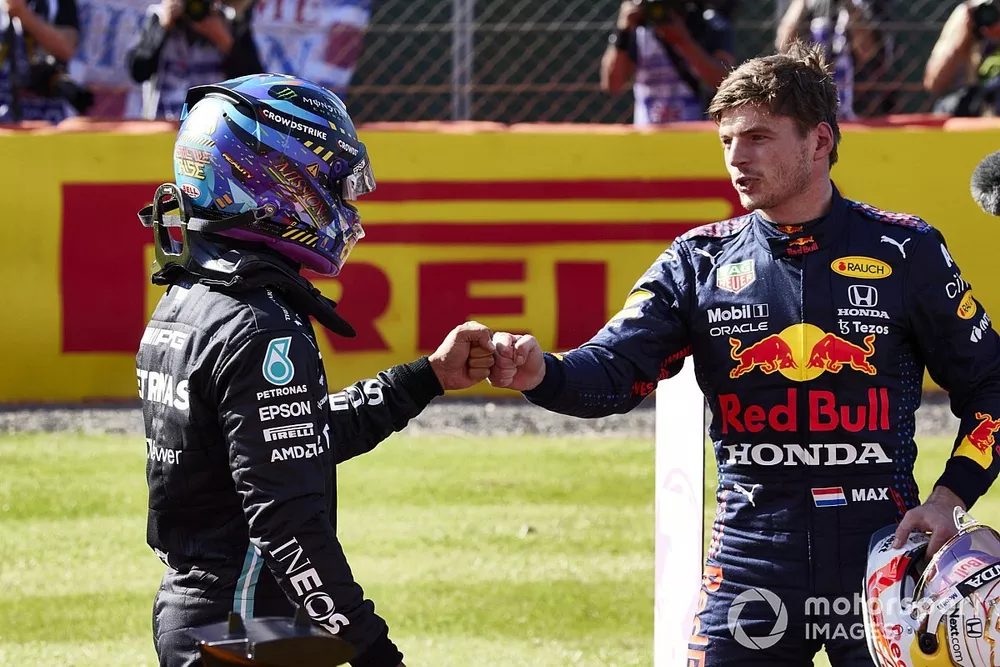 Lewis Hamilton, Mercedes, 2nd position, and Max Verstappen, Red Bull Racing, 1st position, congratulate each other 