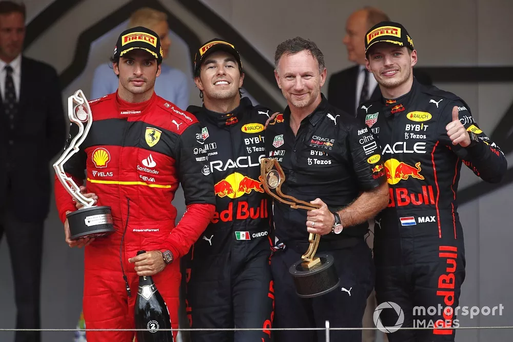 Carlos Sainz, Ferrari, 2nd position, Sergio Perez, Red Bull Racing, 1st position, Christian Horner, Team Principal, Red Bull Racing, Max Verstappen, Red Bull Racing, 3rd position, on the podium