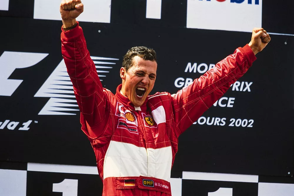 Michael Schumacher, 1st position, celebrates securing his fifth world drivers' championship on the podium.