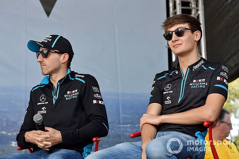 Robert Kubica, Williams Racing, and George Russell, Williams Racing, on stage