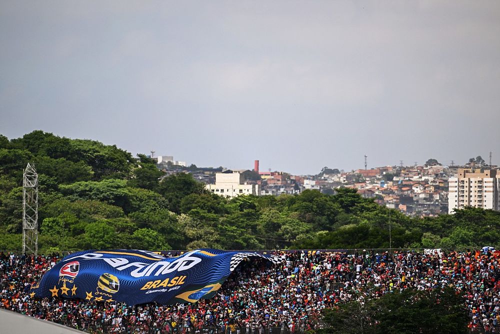 Fans unfurl a huge banner in a grandstand
