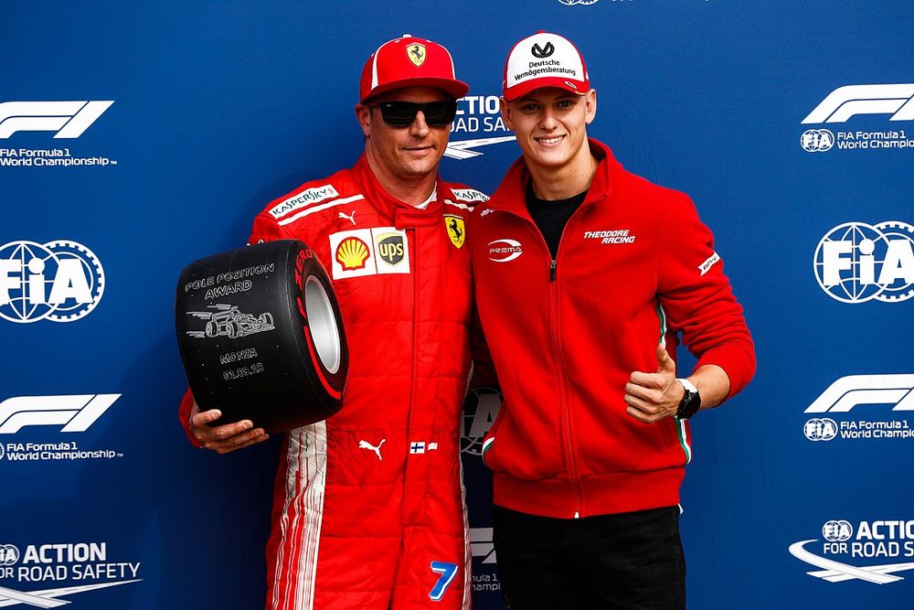 Mick Schumacher presents Kimi Raikkonen, Ferrari, with the Pirelli Pole Position award