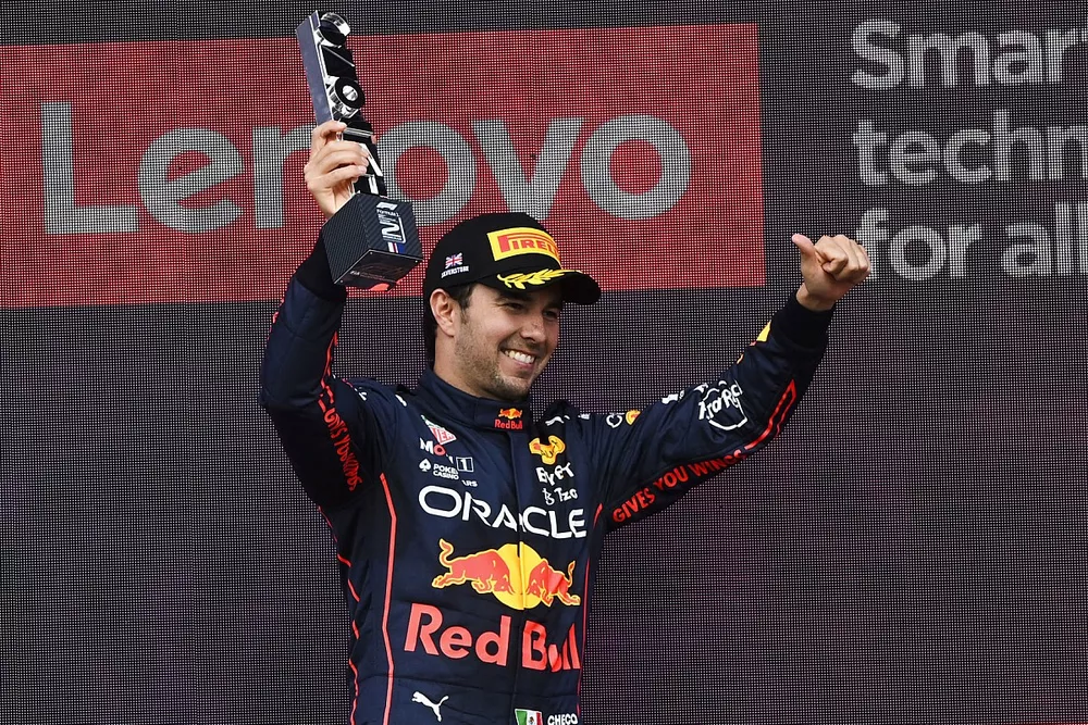 Sergio Perez, Red Bull Racing, 2nd position, ifts his trophy