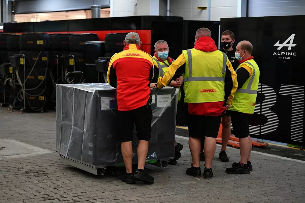 equipment being unloaded in pit lane