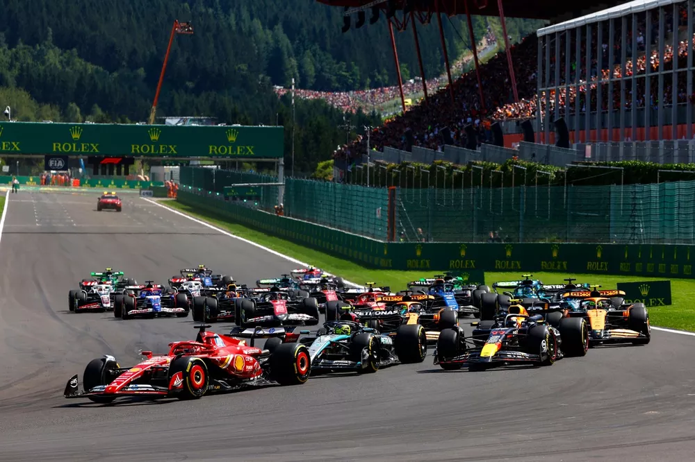 Charles Leclerc, Ferrari SF-24, leads Sir Lewis Hamilton, Mercedes F1 W15, Sergio Perez, Red Bull Racing RB20, Lando Norris, McLaren MCL38, Oscar Piastri, McLaren MCL38, and the rest of the field on the opening lap